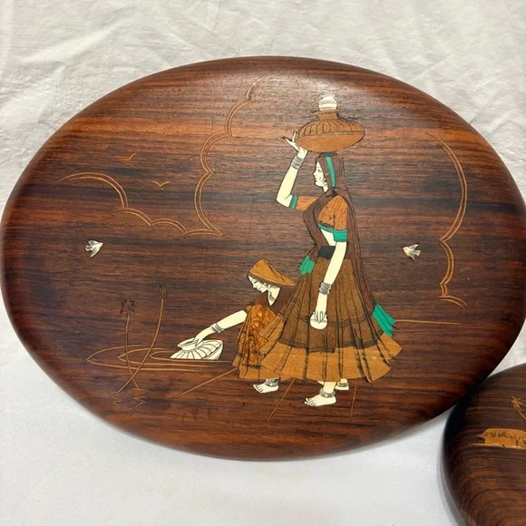 Vintage Indian rosewood wall art plaques with intricate bone inlay designs.